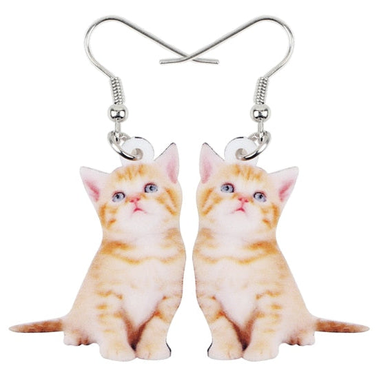 Cat-shaped earrings on a white background