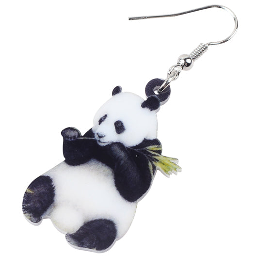 Panda-shaped keychain with a bow tie on a white background