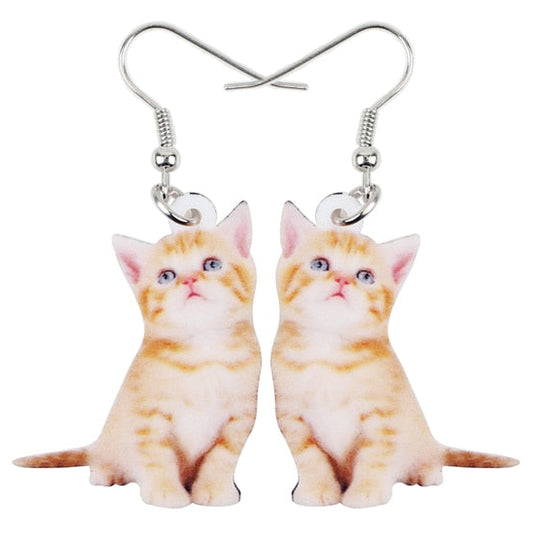 Cat-shaped earrings on a white background