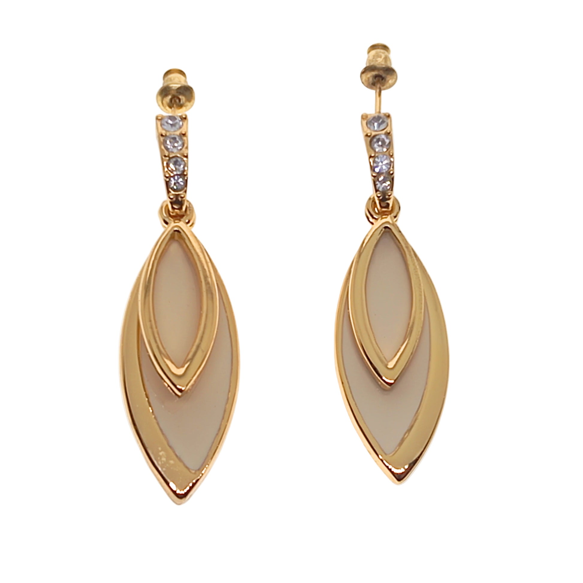 Gold earrings with clear stones on a white background