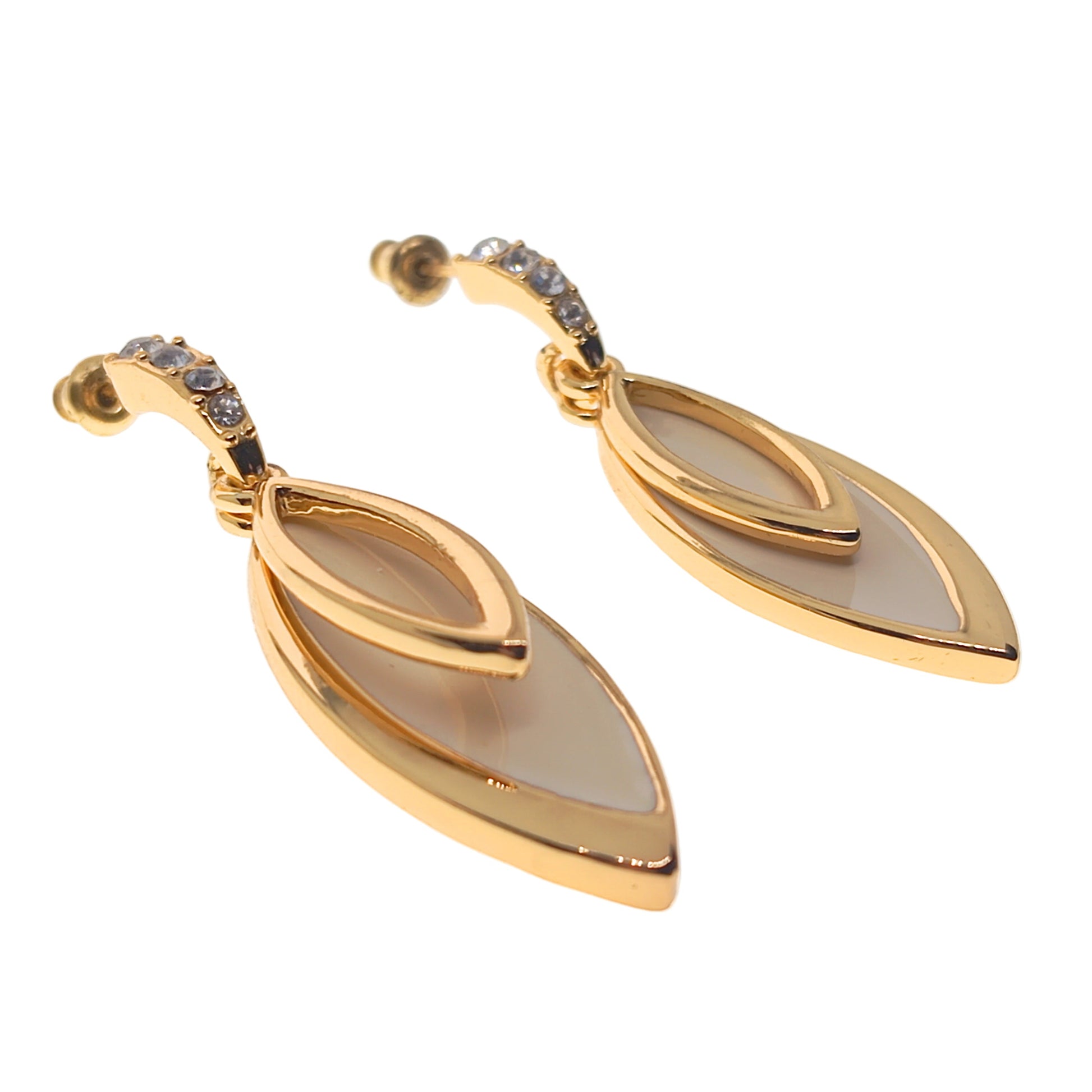 Gold earrings with leaf-shaped design on a white background