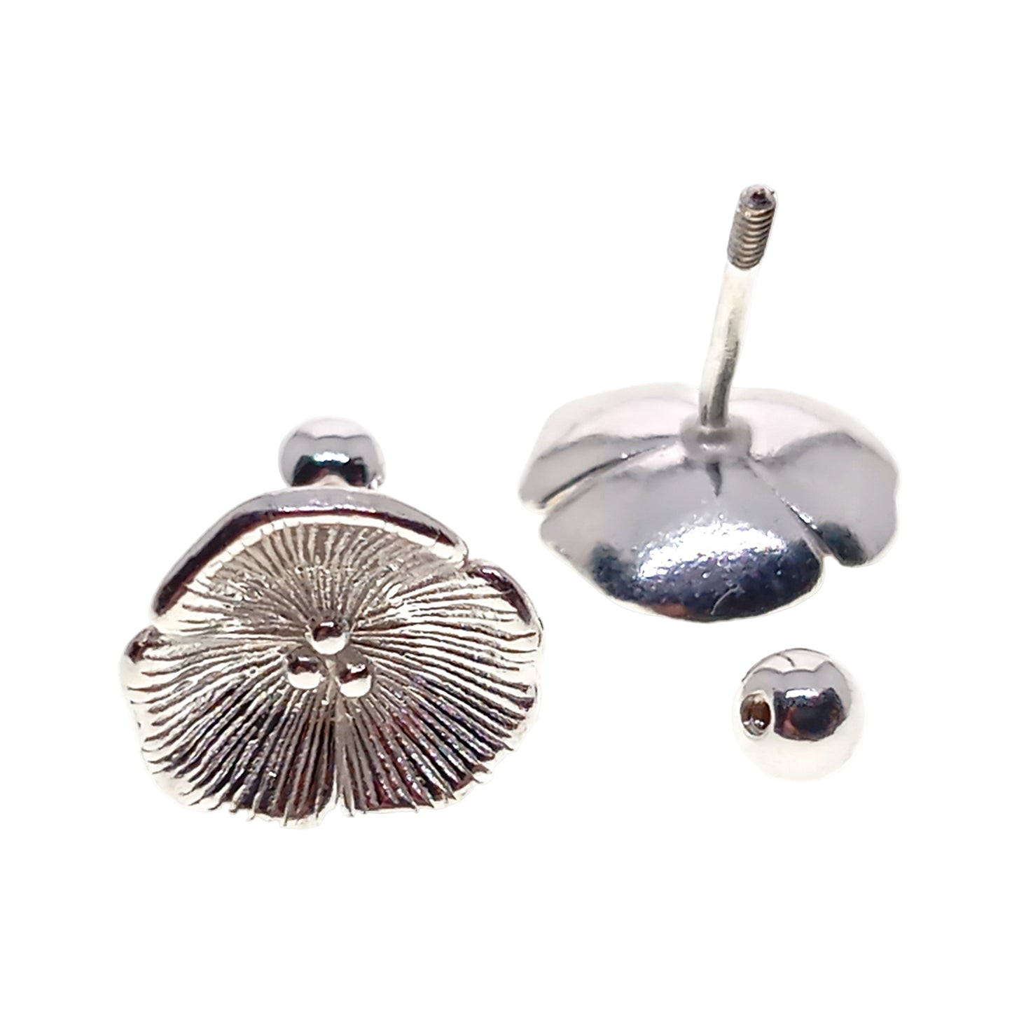 Silver earring components on a white background