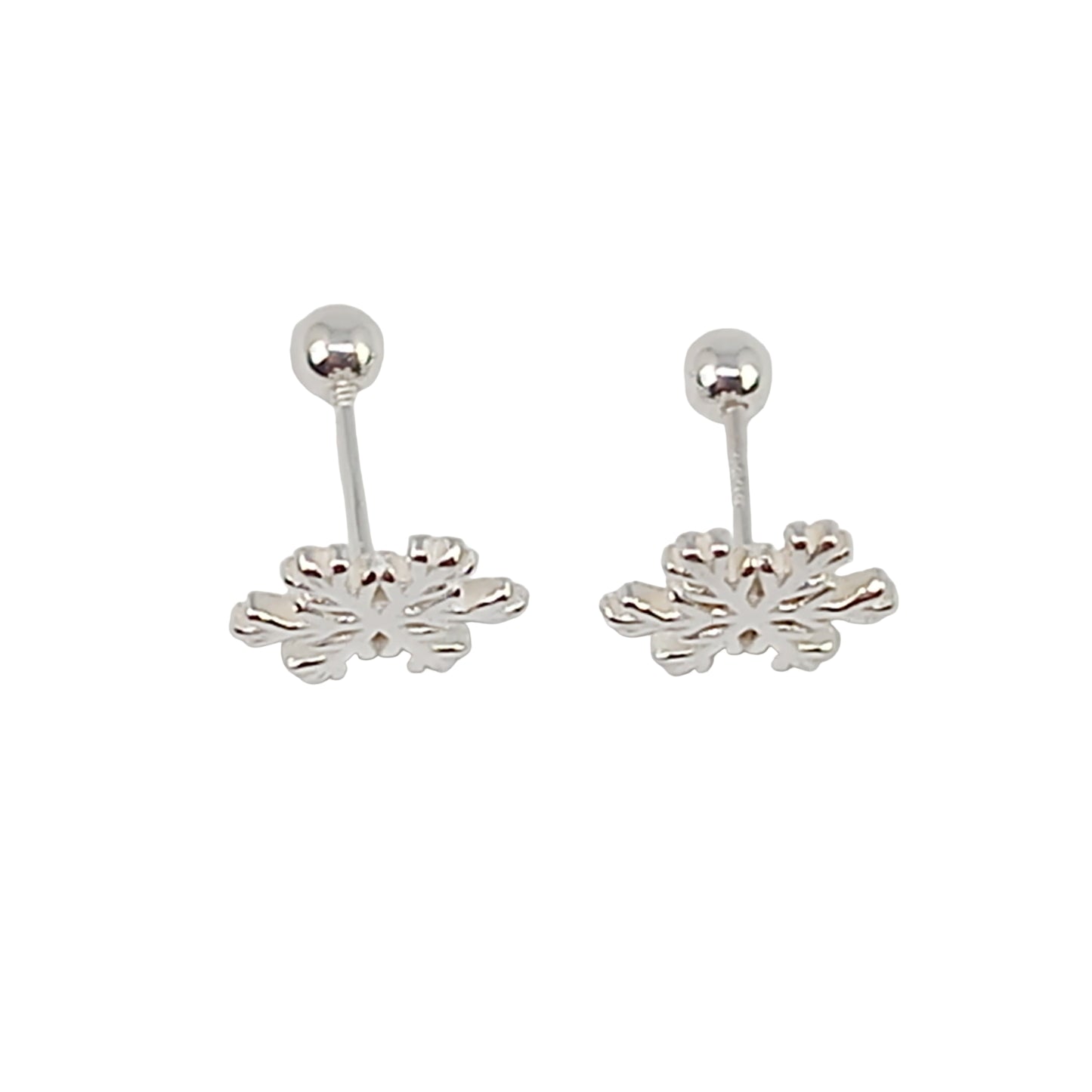 Pair of silver leaf-shaped earrings on a white background