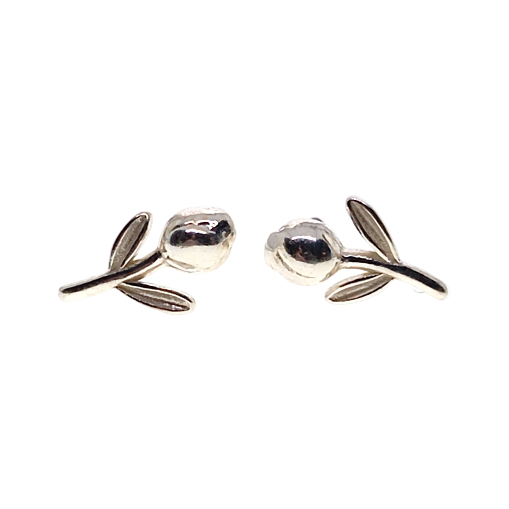 Silver tulip-shaped earrings on a white background