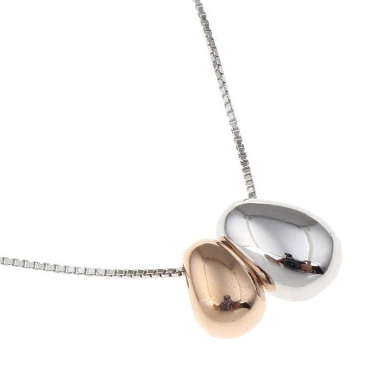 Necklace with two metallic beads, one gold and one silver, on a white background.