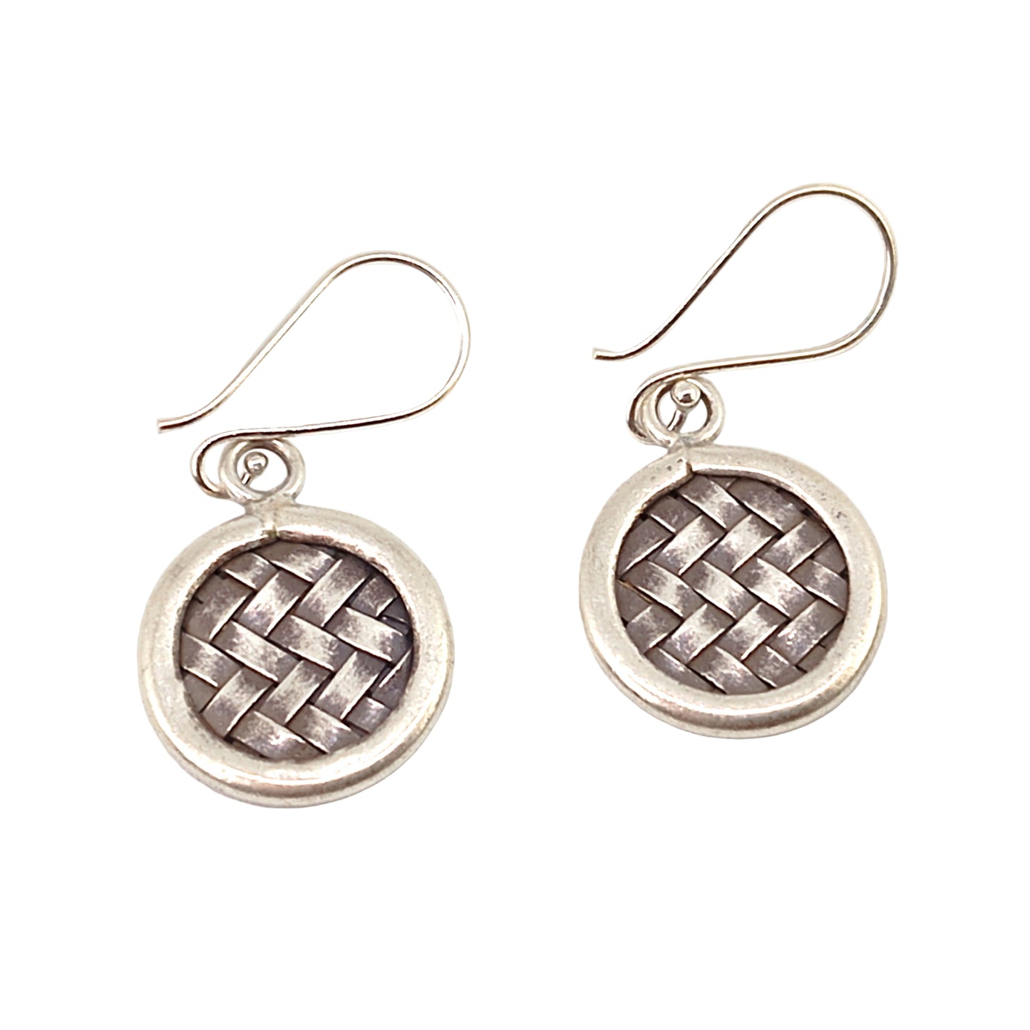 Pair of silver woven earrings on a white background